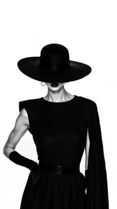 Woman in a wide brim hat and black dress with long gloves