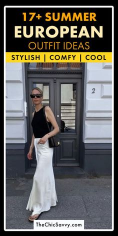 Woman in a black tank top and white maxi skirt on a street