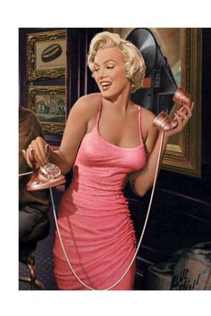Woman in a pink dress holding a rotary phone and smiling