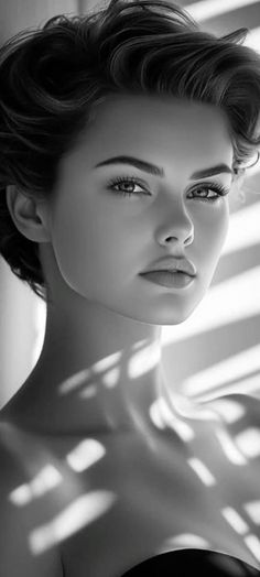 Monochrome portrait of a woman with short hair and dramatic lighting