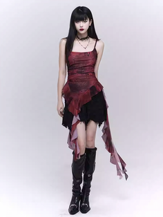 Woman with long black hair in a gothic mini dress and black boots