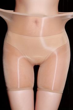Lower torso and thighs in sheer, light-colored underwear with exposed skin