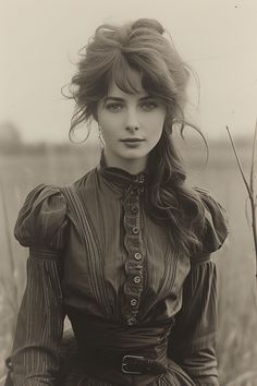 Woman with long hair and a high-collared dress in sepia tone