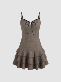 Plaid mini dress with ruffle skirt and bow detail on a plain background