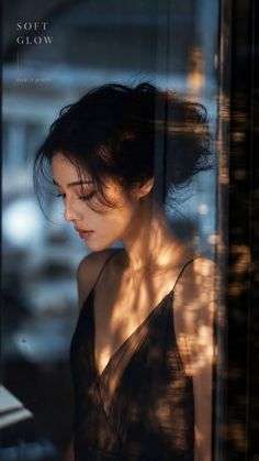 Woman in a black dress with soft lighting and golden hour glow