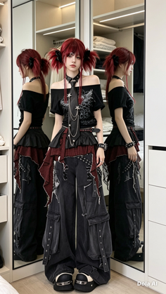 Person with red pigtails in gothic fashion posing in front of a mirror