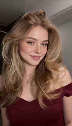 Woman with blonde hair wearing an off-shoulder dress and a gold necklace