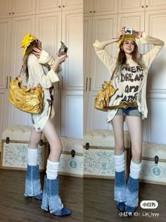 Woman in a distressed sweater and denim shorts posing with a camera indoors