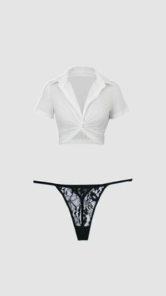 White crop top and black lace g-string on a plain background