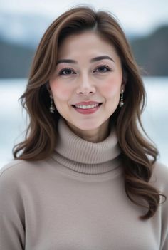 Woman with long brown hair wearing a turtleneck sweater outdoors