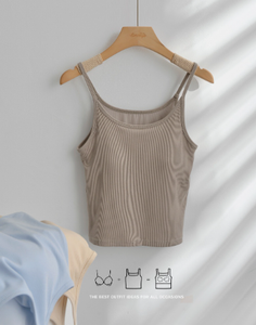 Beige ribbed tank top on a wooden hanger against a white wall