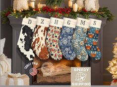 Christmas stockings with various patterns hanging from a decorated fireplace mantel