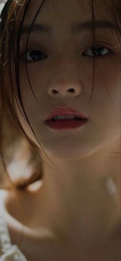 Close up portrait of a person with wet hair and red lips