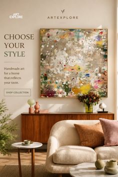 A modern living room with an abstract painting above a wooden cabinet