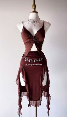 Brown two-piece outfit with a ruffled skirt and silver chain belt on a mannequin