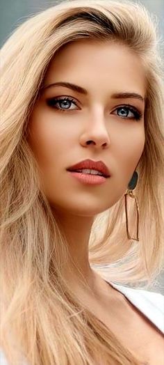 Close up portrait of a woman with blonde hair and blue eyes