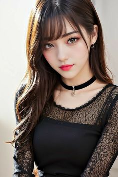 Woman with long brown hair and a black lace top wearing a choker
