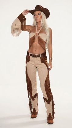 Woman in a cowboy hat and fringe outfit with exposed midriff
