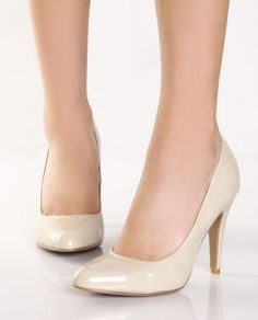 Pair of beige glossy high heels with pointed toes on a white background