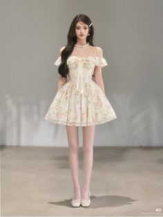 Woman in a floral off-shoulder dress and white tights standing indoors