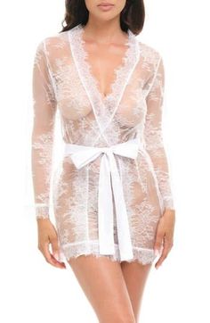 Woman in a white lace robe with a white ribbon tie