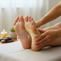 Close up of feet receiving a reflexology massage in a spa setting