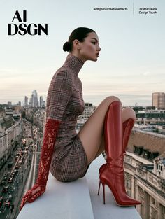 Woman in a plaid dress and red boots sitting on a rooftop overlooking a cityscape