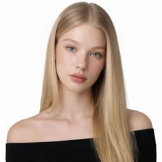 Young woman with long blonde hair and blue eyes wearing an off-shoulder top