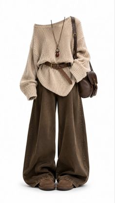 Full body shot of a neutral-toned outfit with a knitted sweater and wide leg pants