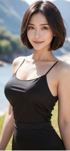 Woman with short hair wearing a black top outdoors