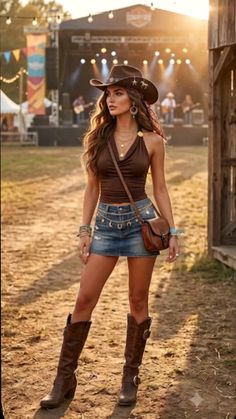Woman in a cowboy hat and denim skirt at an outdoor country festival