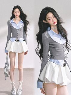 Woman with long black hair wearing a mini skirt and cardigan