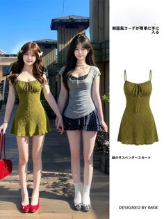 Two women in short dresses holding hands outdoors