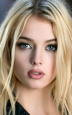 Close up portrait of a woman with blonde hair and blue eyes