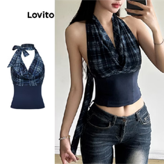 Woman in a plaid halter top and jeans, holding a phone