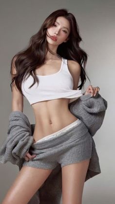 Woman in a white tank top and grey shorts pulling down her clothing