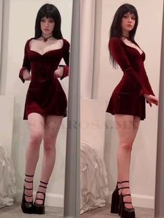 Woman in a red velvet dress and platform shoes posing indoors
