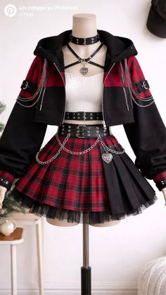 Gothic-style outfit with a plaid skirt, cropped jacket, and harness top on a mannequin