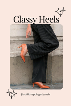 Person wearing orange heels and pinstripe pants outdoors