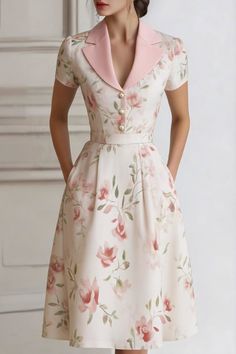 Woman in a floral midi dress with a pink collar and pearl buttons