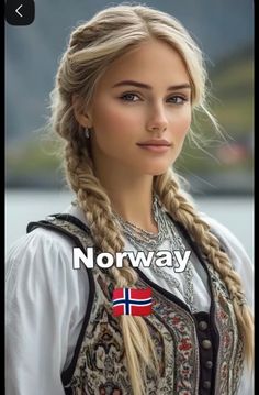 Woman with blonde braids wearing traditional clothing and jewelry outdoors