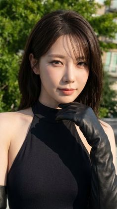 Woman in a black halter top and long leather gloves outdoors