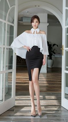 Woman in an off-shoulder top and a black pencil skirt with a high slit