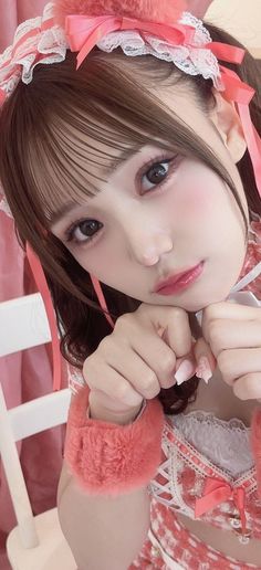 Woman with pink ribbons and lace trim in a cute pose