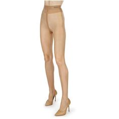 Pair of legs wearing nude tights and beige high heels on a white background