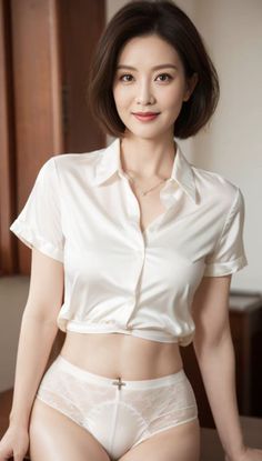 Woman with short hair wearing a white shirt and lace underwear