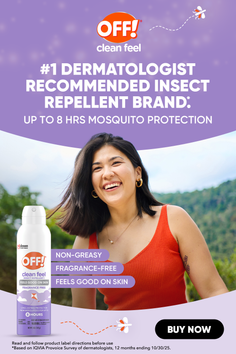 Woman in an orange top smiling outdoors with an insect repellent can
