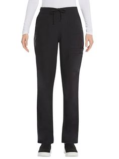 Person wearing black drawstring pants with a white long sleeve shirt and black shoes