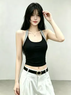 Woman with long black hair wearing a black halter top and white pants