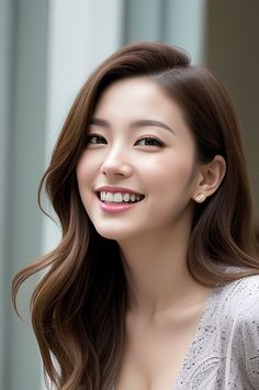 Smiling woman with long brown hair and earrings, showing cleavage